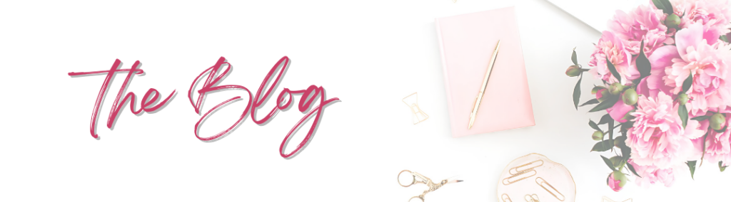 Stylized blog header with the words 'The Blog' in pink cursive font, accompanied by a pink notebook, gold pen, gold office accessories, and a bouquet of pink flowers on a white background.